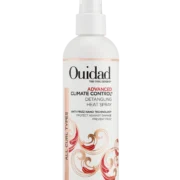 Close-up of a bottle of Ouidad Detangling Heat Spray curly hair product against a transparent background.