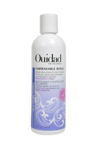 Close-up of a bottle of Ouidad Featherlight Volumizing Foam curly hair product against a transparent background.